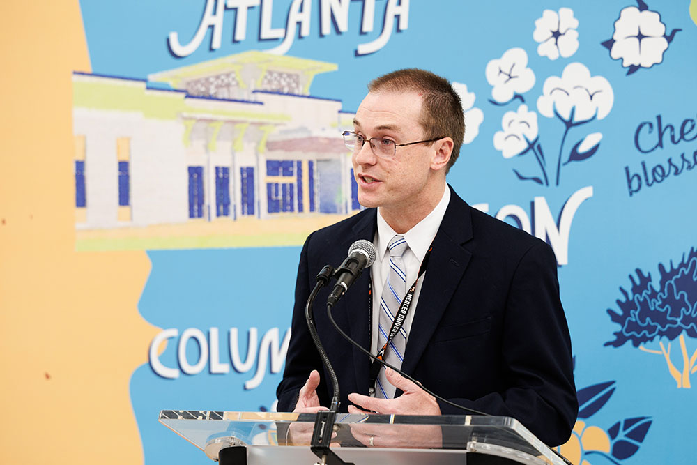 Jonathan Smith, M.D., speaks at a podium