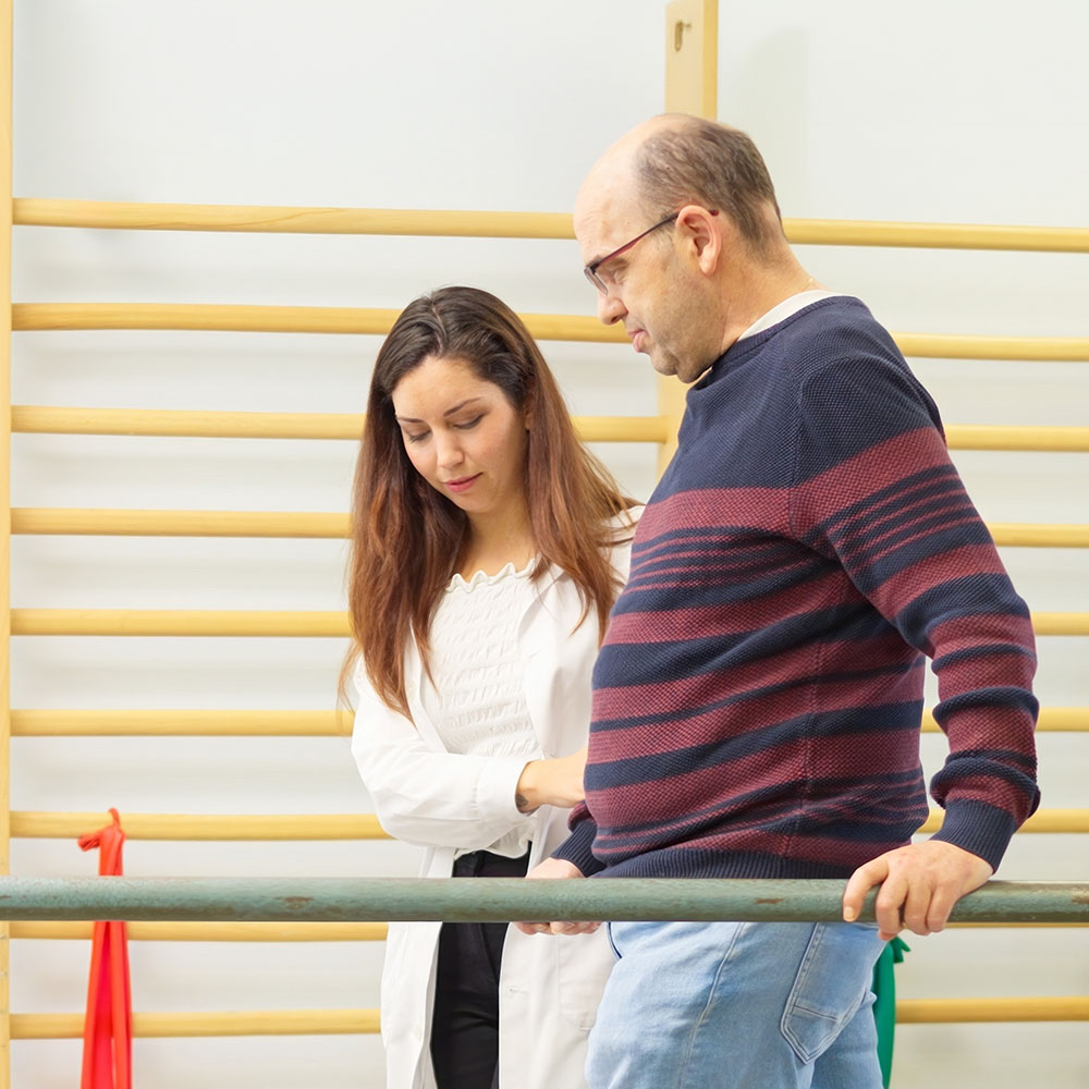 Older man getting physical therapy treatment