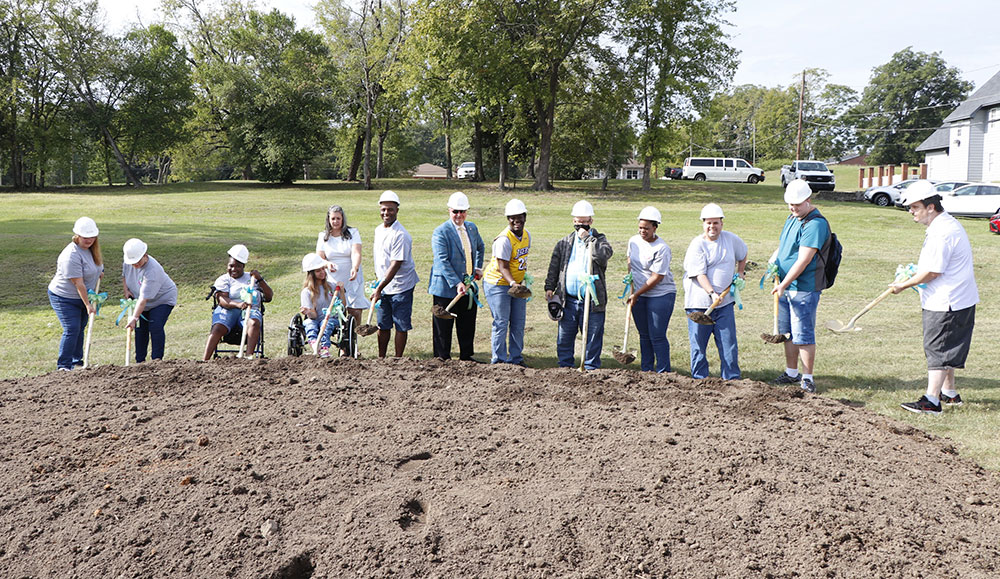 Dignitaries, breaking ground at the site of a new crisis support and diagnostic center.